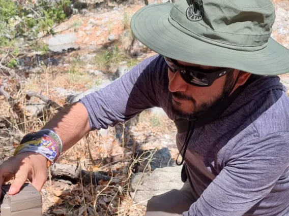 Miguel Grageda setting up wildlife camera